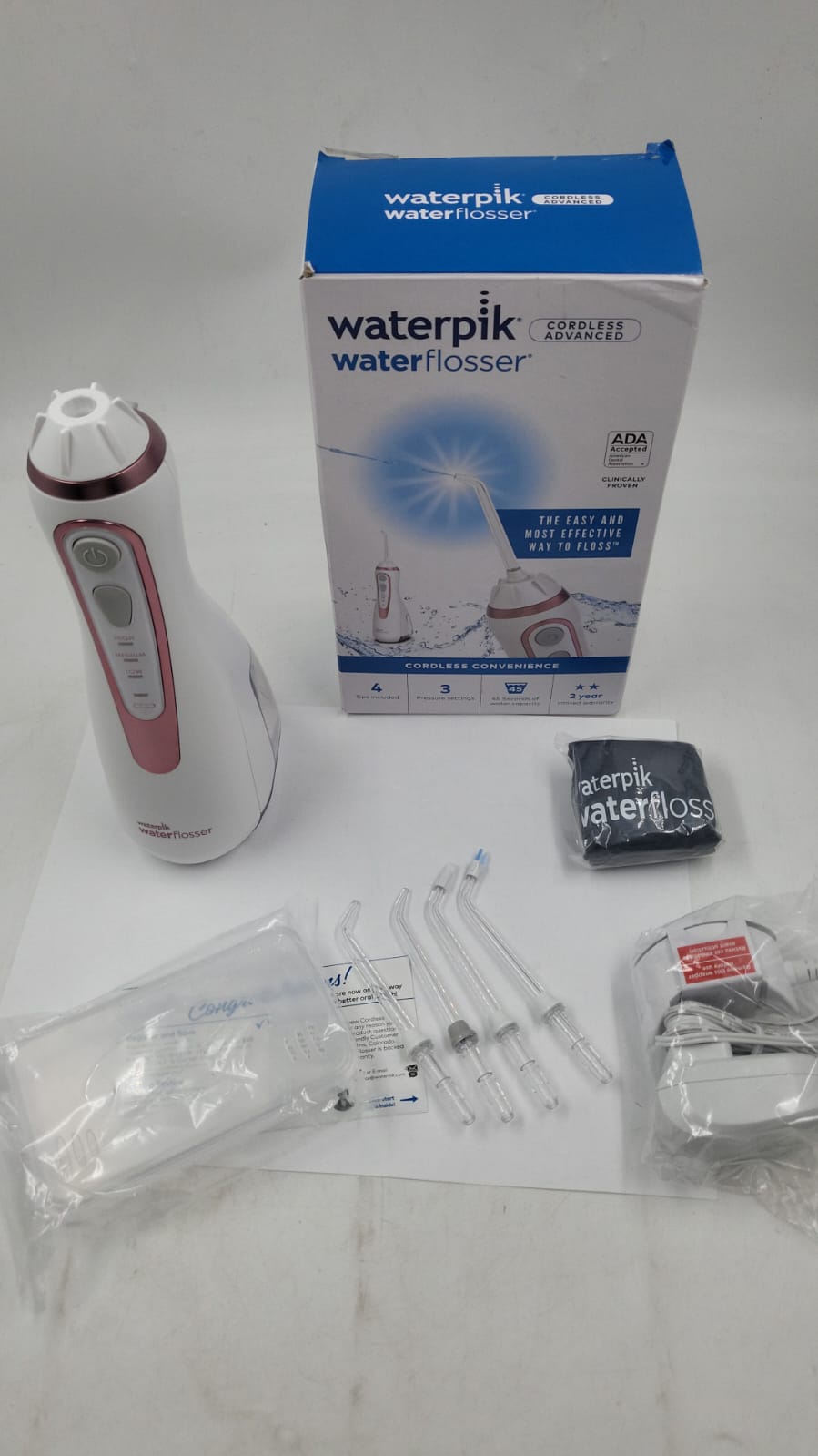 Waterpik Irrigador bucal portátil recargable con hilo dental inalámbrico
