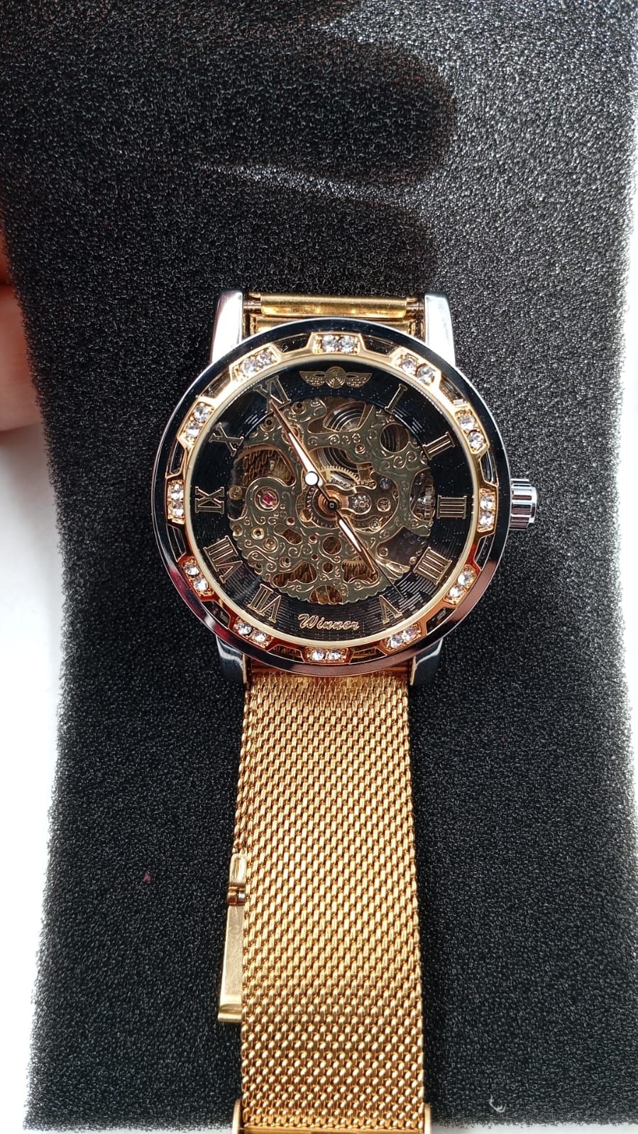 Reloj mecánico, diseño de esqueleto y talla de flores, Winner.