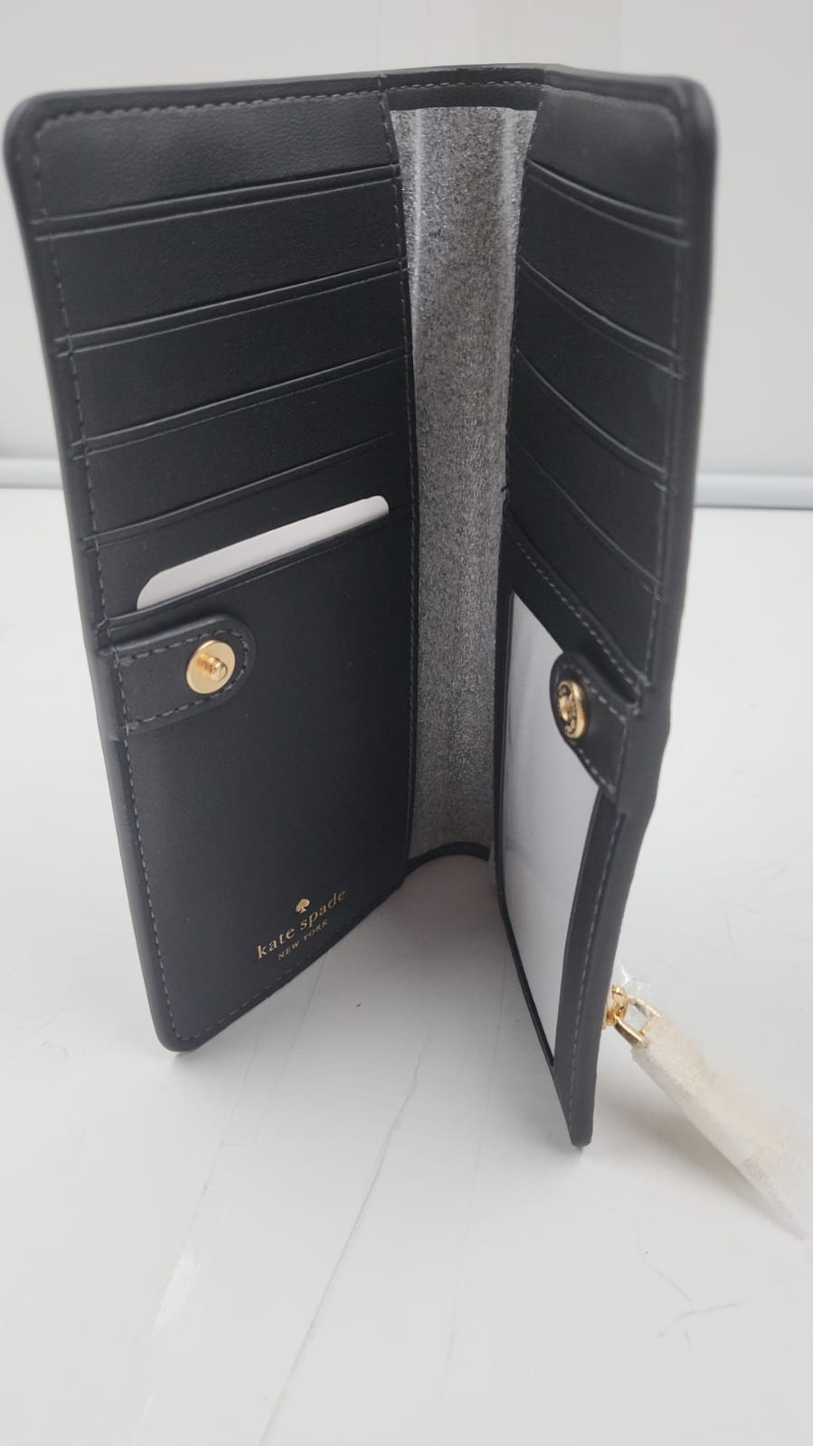 Cartera grande y delgada Madison. Kate Spade