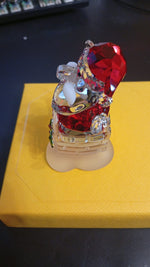 Figura de Swarovski, Santa Claus y Chimenea 5701507, Original.