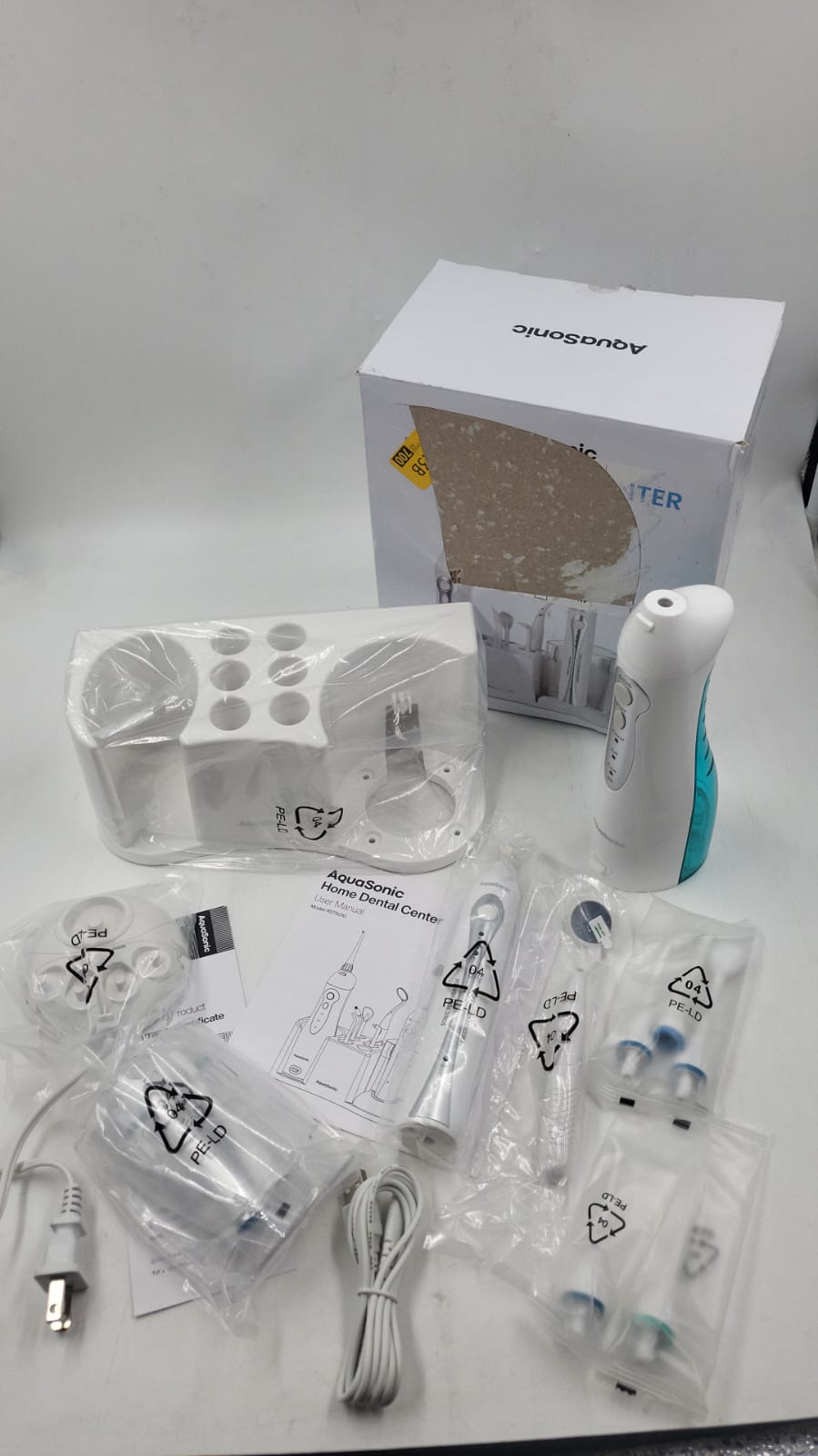 Centro Dental Cepillo de dientes recargable y hilo dental inteligente AquaSonic