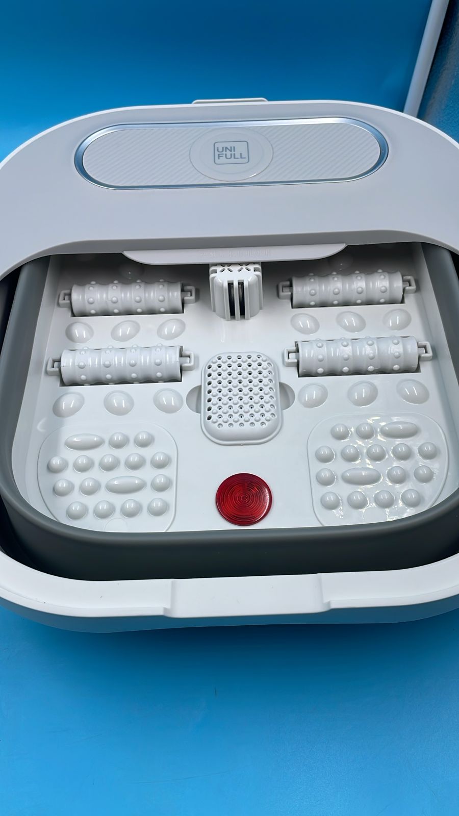 Bañera plegable para pies con rodillos de calor y masaje.