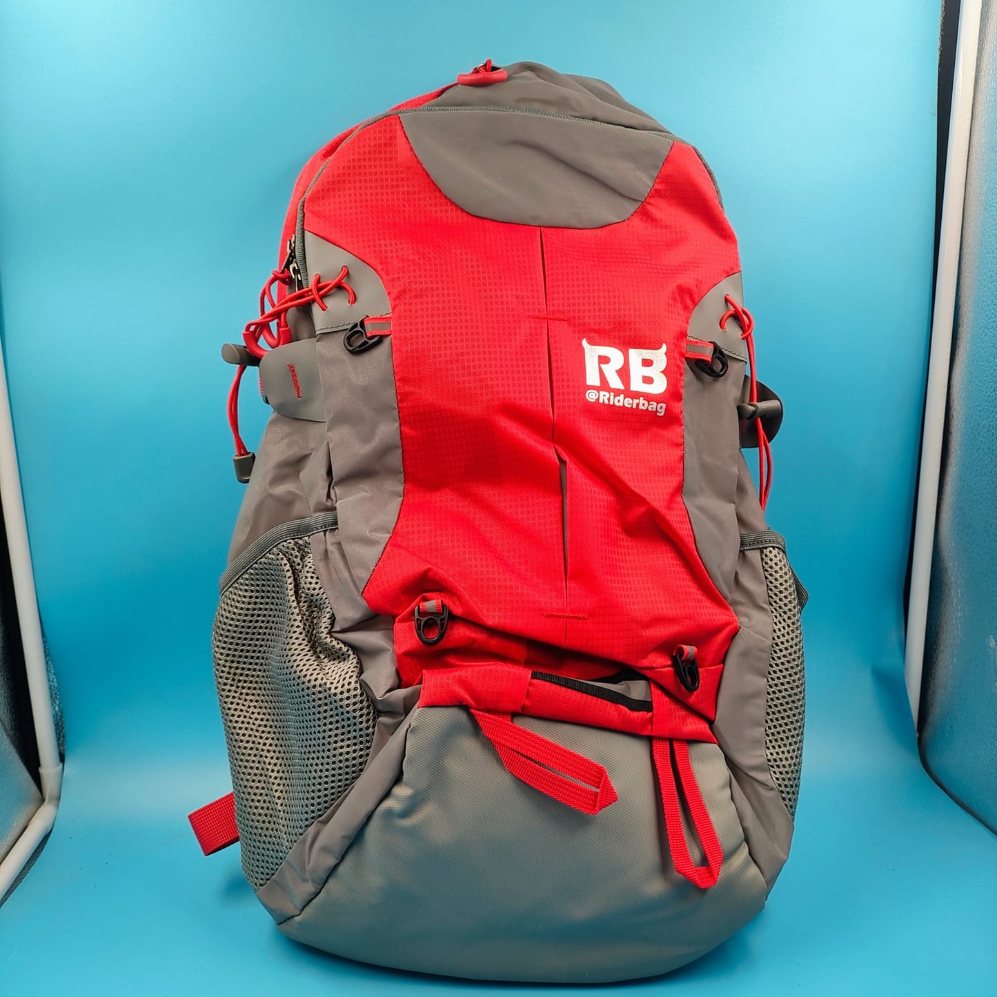 Mochila reflectante RIDERBAG.Alta visibilidad, viajeros, motocicleta, color roja.