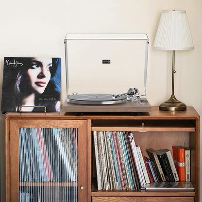 Reproductor de discos, transmisión por correa, 33-45 rpm.