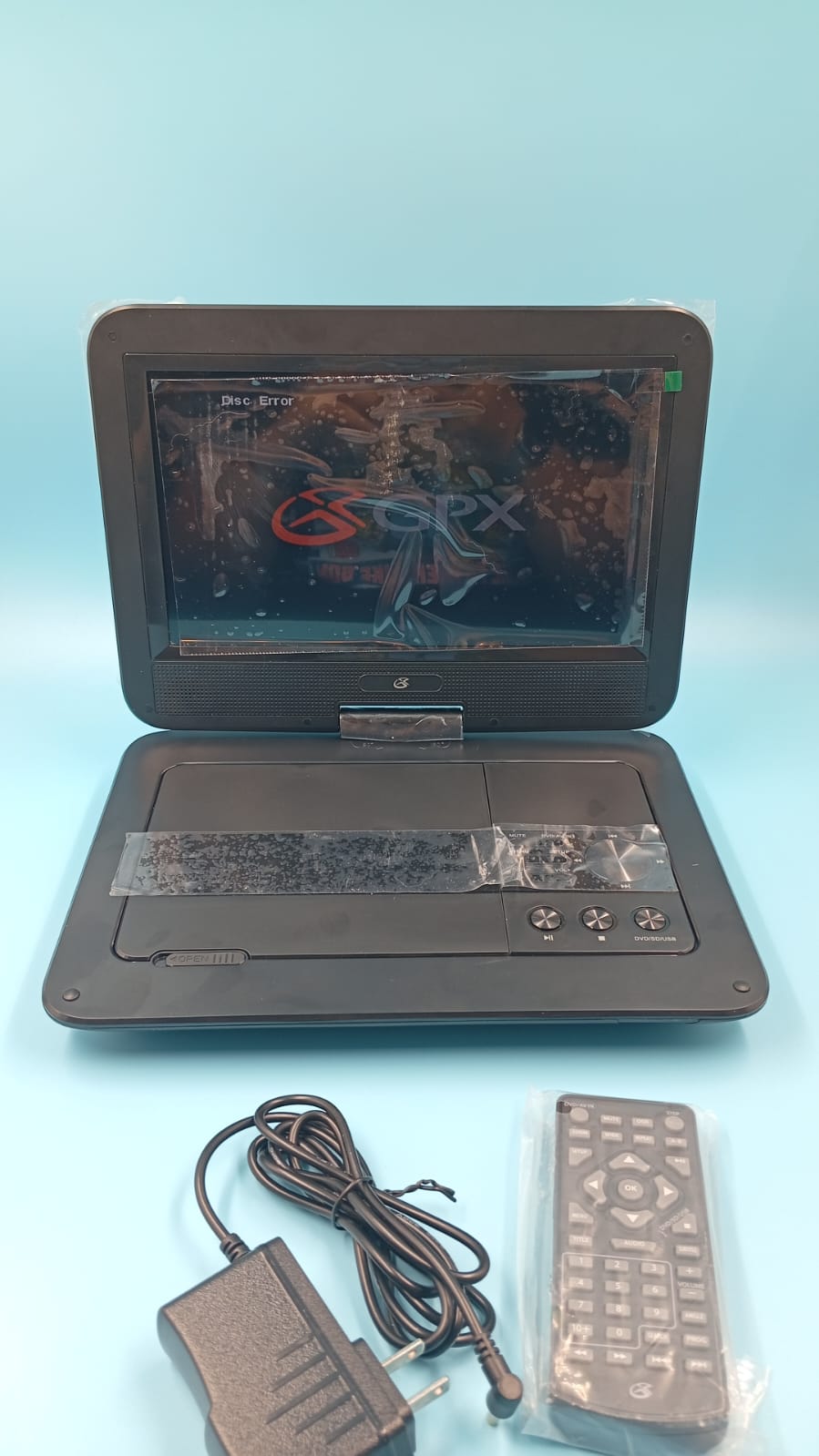 Reproductor DVD portátil, GPX de 10.1", recargable, control remoto.(USADO).