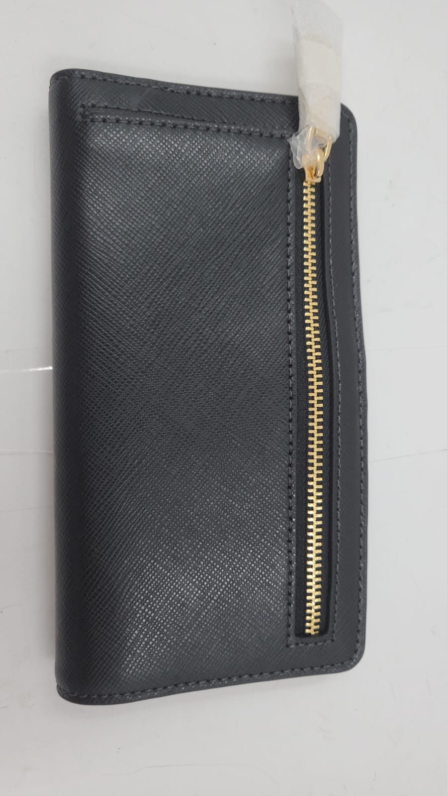 Cartera grande y delgada Madison. Kate Spade