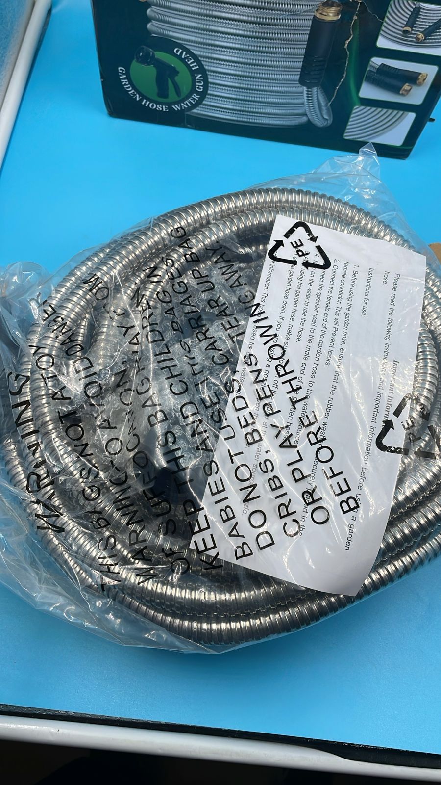 Manguera de jardín de acero inoxidable de 50 pies con boquillas de 10 funciones.